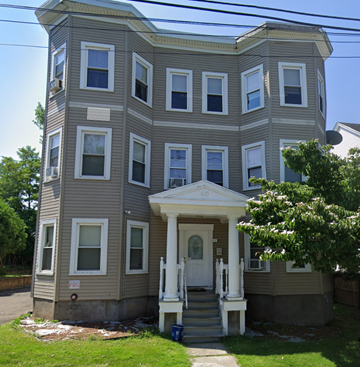 Chicopee apartment for rent - the front of a house with a white door and stairs