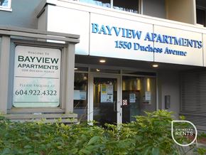 West Vancouver apartment for rent - The front of Bayview Apartments with a sign welcoming people to the building.