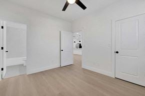 Houston apartment for rent - a bedroom with two closets and a door to a bathroom