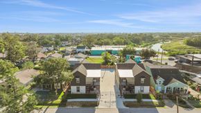 Houston apartment for rent - an aerial view of a neighborhood with houses and trees
