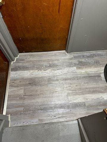 Syracuse apartment for rent - A wooden floor with a grey tile pattern.