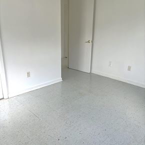 Gonzales apartment for rent - an empty living room with white walls and a tile floor