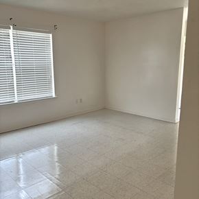 Gonzales apartment for rent - an empty room with a window and a tiled floor