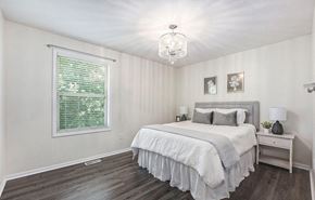 Kentwood house for rent - a bedroom with a bed and a window