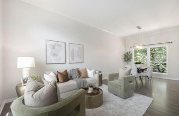 Kentwood house for rent - the living room of an apartment with a couch and chairs