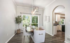 Kentwood house for rent - a dining room with a large window and a table