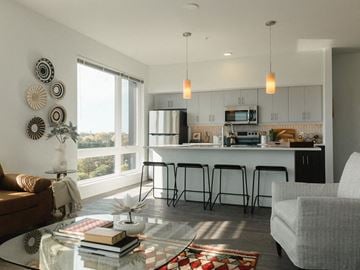 Richmond apartment for rent - a living room with a kitchen and a table