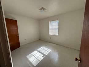 Hattiesburg apartment for rent - A room with a door, window, and a ceiling fan.