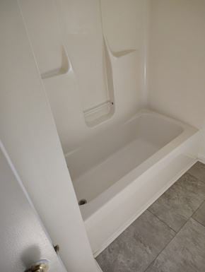 Grayson house for rent - a bathroom with a shower and a toilet in it