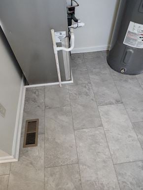 Grayson house for rent - a tiled floor in a room with a furnace and a heater