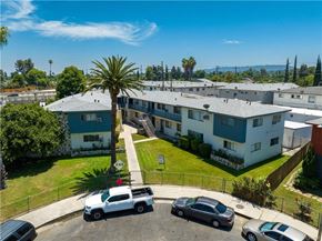 Winnetka apartment for rent - A palm tree stands in front of apartment buildings.
