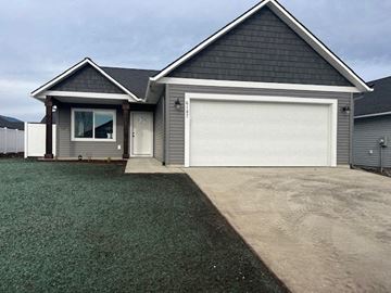 Rathdrum house for rent - a gray house with a white garage door