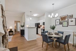 Midlothian apartment for rent - A dining room with a white table and chairs.