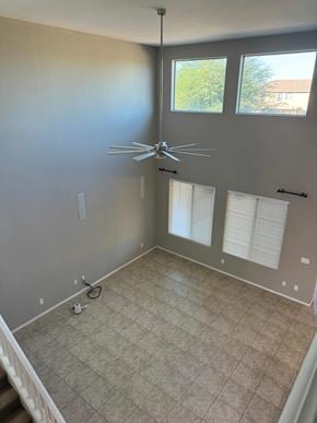 San Tan Valley house for rent - a living room with a ceiling fan and a tiled floor