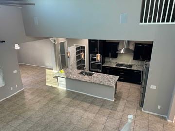 San Tan Valley house for rent - a large kitchen with a large island in the middle