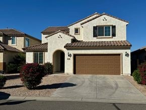 San Tan Valley house for rent - a house with a garage door in front of it