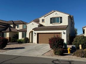 San Tan Valley house for rent - a house with a garage door in front of it