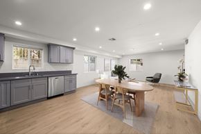 North Hollywood apartment for rent - A modern kitchen with a dining table and chairs.