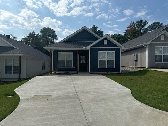Little Rock house for rent - a blue house with a concrete driveway
