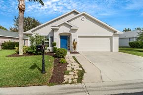Fort Myers house for rent - A house with a blue door and a mailbox on the left.