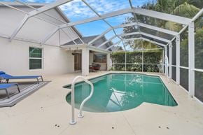Fort Myers house for rent - A pool inside a house with a glass ceiling.