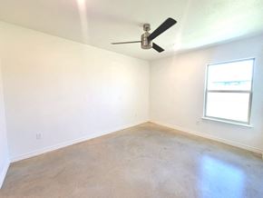 Copperas Cove house for rent - an empty room with a ceiling fan and a window