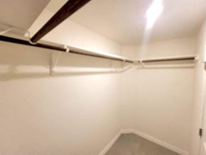 Copperas Cove house for rent - an empty basement room with white walls and a pipe on the ceiling