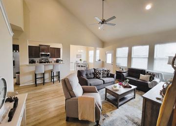 Killeen house for rent - the living room and kitchen of a home with couches and chairs