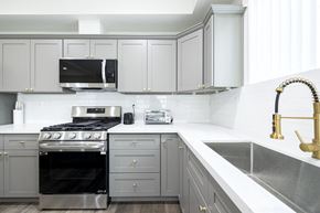 Los Angeles apartment for rent - a white kitchen with stainless steel appliances and white cabinets