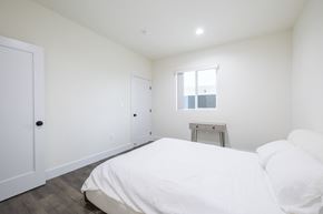 Los Angeles apartment for rent - a bedroom with white walls and a white bed and a window