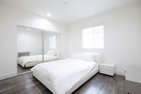 Los Angeles apartment for rent - two white beds in a room with a mirrored closet