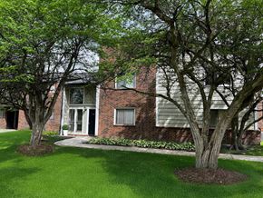Dewitt apartment for rent - A tree in front of a building with a white door.