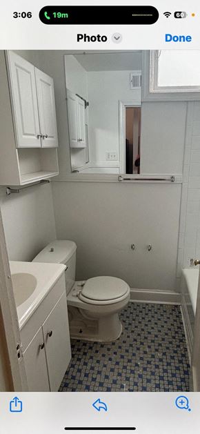 Washington apartment for rent - a white bathroom with a toilet and a sink