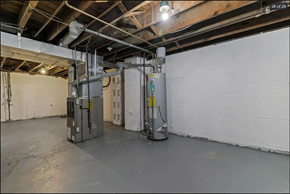 Ferguson house for rent - the inside of a building with a large room with a boiler and a refrigerator