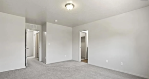 Meridian apartment for rent - an empty bedroom with white walls and a carpeted floor