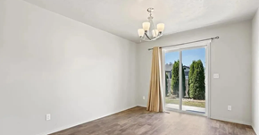 Meridian apartment for rent - an empty living room with a sliding glass door to a backyard