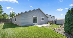 Meridian apartment for rent - a white house with a grassy yard and a fence