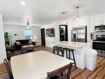 Atlanta apartment for rent - an open kitchen and living room with a dining room table