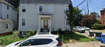 Norwich Ct apartment for rent - a white house with a car parked in front of it