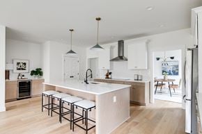Richmond house for rent - a large kitchen with an island and stools