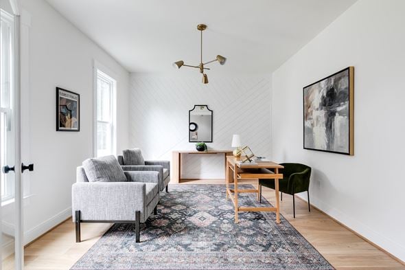 Richmond house for rent - a living room with a couch and a desk and a rug