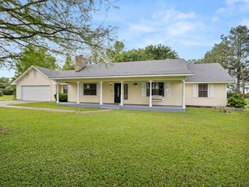 Leesville house for rent - a white house with a lawn in front of it