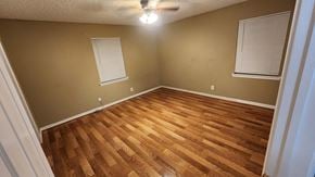 Killeen house for rent - a living room with wood floors and a ceiling fan