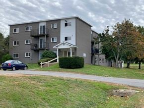 Kentville apartment for rent - an apartment building with a blue car parked outside