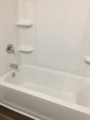 Kentville apartment for rent - a white bathroom with a tub and a shower