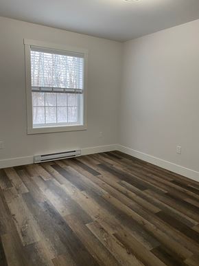 Kentville apartment for rent - an empty room with wooden floors and a window