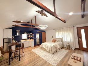 Merced house for rent - a bedroom with a bed and a ceiling fan