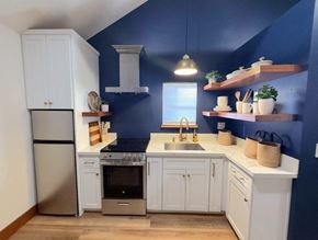 Merced house for rent - a small kitchen with a sink and a refrigerator