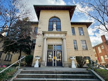 Louisville apartment for rent - a building with stairs and a statue in front of it