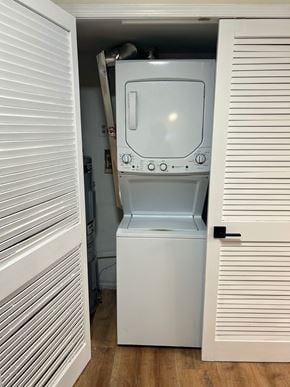 Bowie house for rent - A white washing machine is in a small space between two white doors.